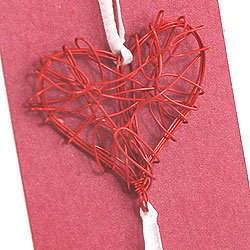 Use wire embellishments to decorate invitations